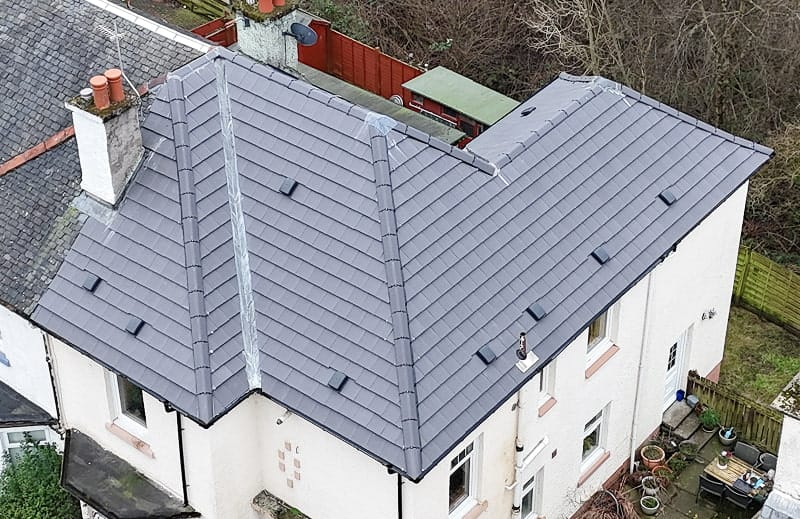 Beautiful home with a new tile roof installed by Speedy Roofing in Hamilton