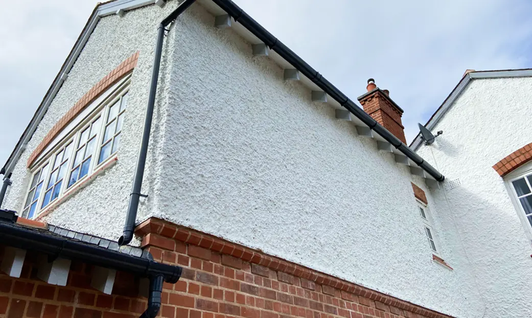 Newly roughcasted exterior of a home in Greenock by Speedy Roofing