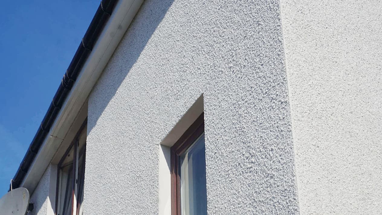 Newly roughcasted exterior of a home in Greenock by Speedy Roofing