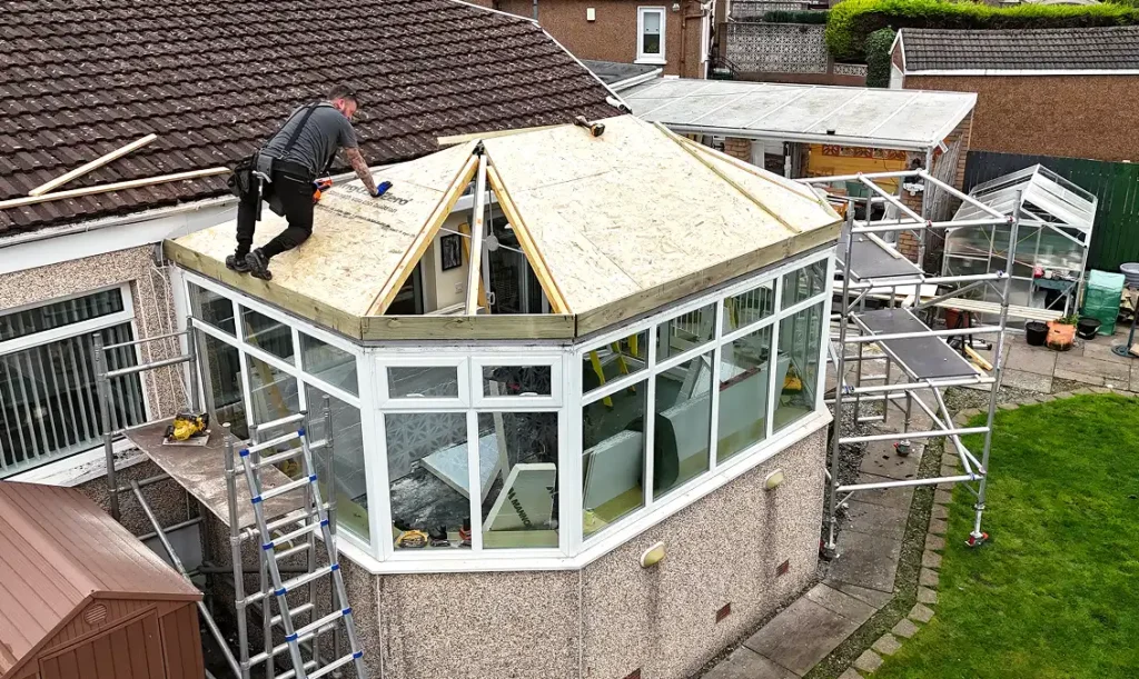 Speedy Roofing specialist installing a new insulated conservatory roof in Glasgow home