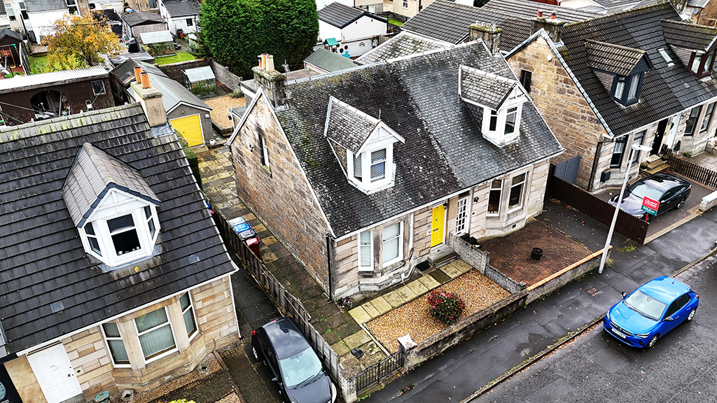 Original roof showing visible wear, ageing materials, and areas of deterioration before replacement.